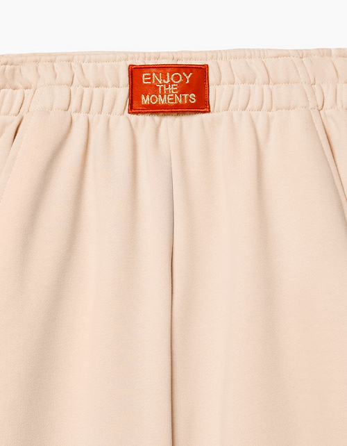 Бежевые брюки-джоггеры для девочки