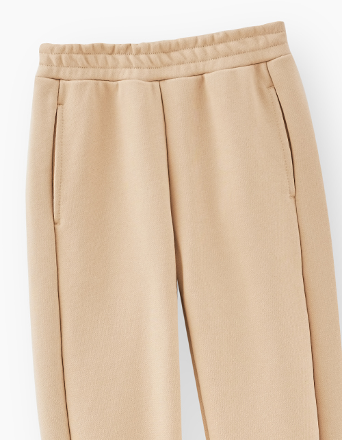 Бежевые брюки-джоггеры для мальчика Бежевые брюки-джоггеры для мальчика