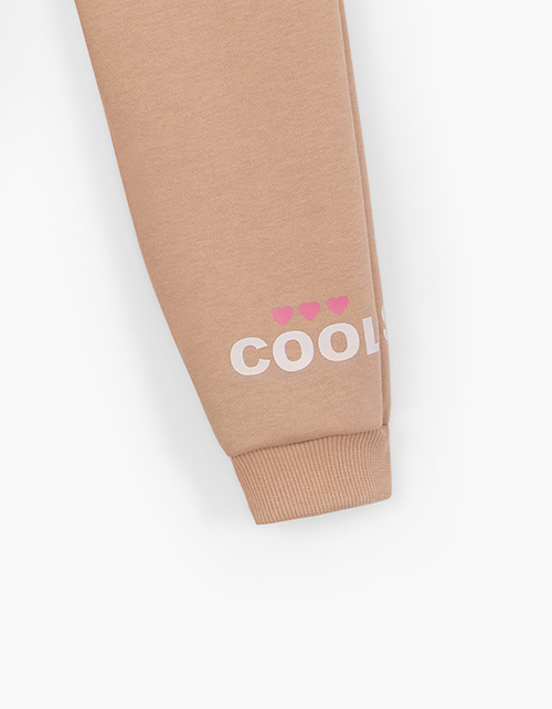 Бежевые брюки-джоггеры для девочки