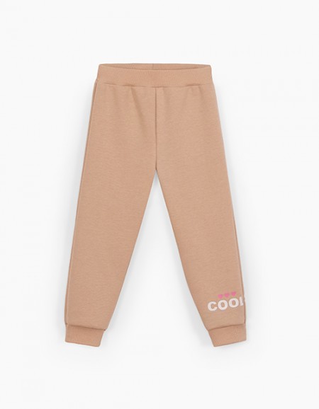 Бежевые брюки-джоггеры для девочки